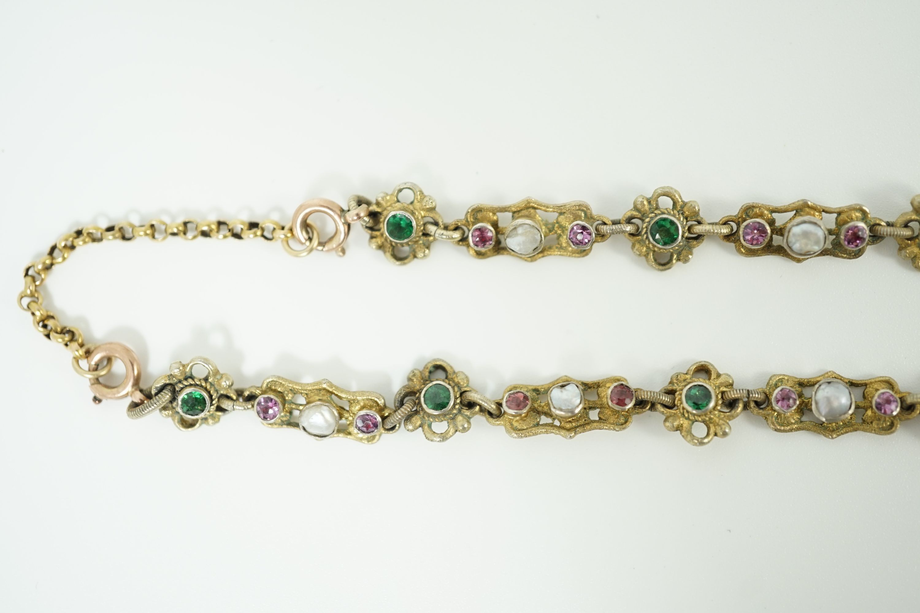 An early 20th century pierced and engraved silver gilt and gem set choker necklace, in the Suffragette colours